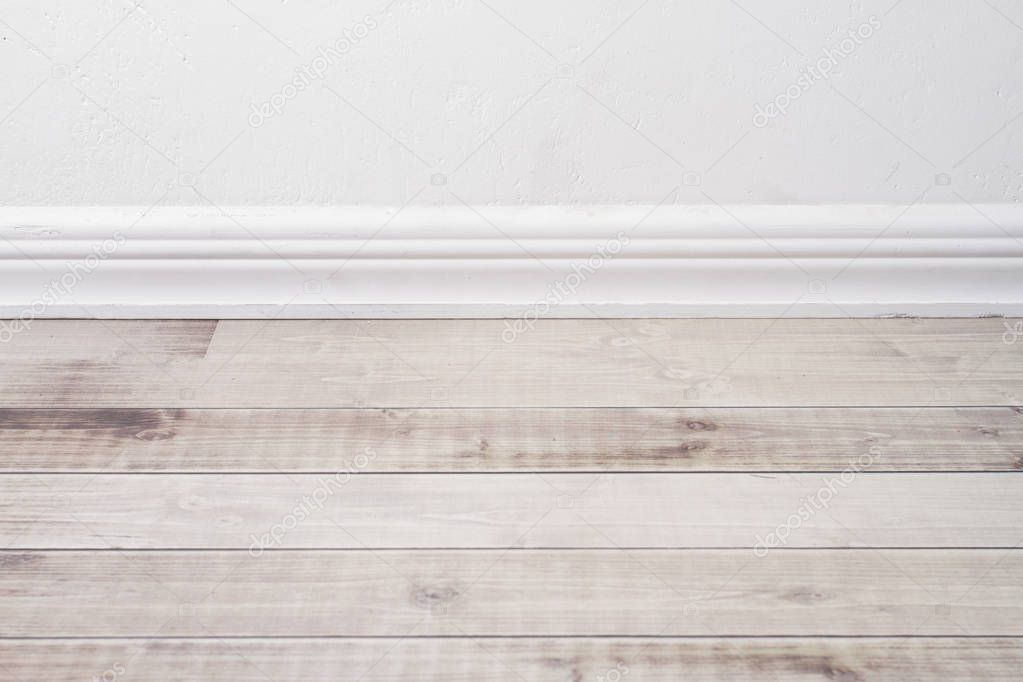 wooden floor and plaster skirting board