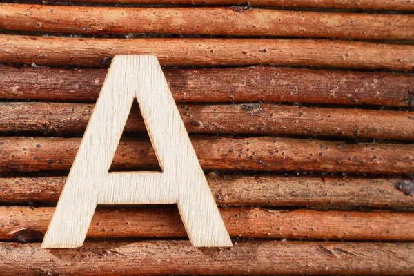 Letter A of wood-made alphabet, top view and space for text — Stock Photo, Image