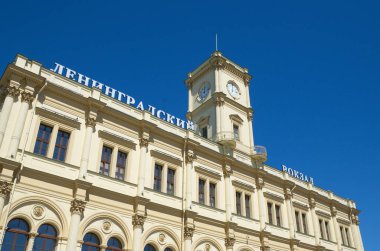 Fragment of the Leningrad station building against the blue sky, Moscow, Russia. It was built in 1851 clipart