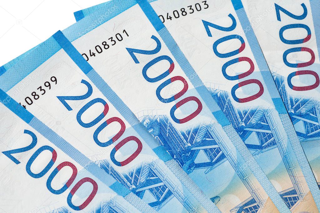 New Russian banknotes of 2000 rubles close-up on a white background