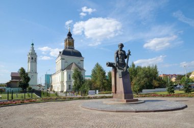 Tula, Russia - September 12, 2019: Monument to Nikita Demidov on the background of Nikolo-Zarechenskaya Church clipart