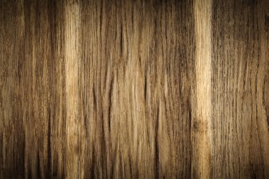 Eskimiş ve yıpranmış, kabartma kabartmalı yüzeyi olan eski bir mobilya panelinin orijinal koyu kahverengi arka planı.