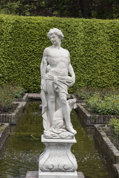 Medieval sensual male sculpture in the gardens of Castle of Arcen, Netherlands.