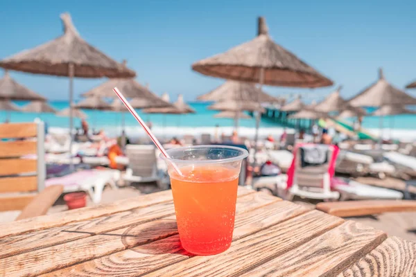 juice color cocktail during touristic vacation. umbrellas