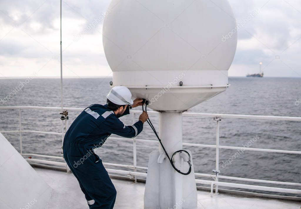 Service technician or serviceman near VSAT terminal