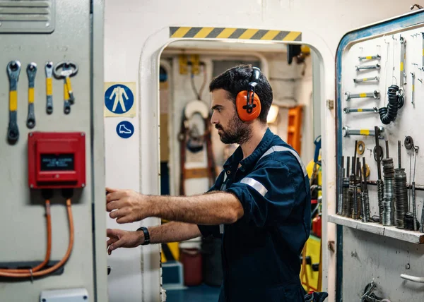 Marine engineer officer working in engine room