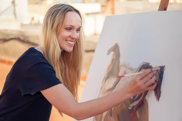 Young woman paint artist drawing at home roof