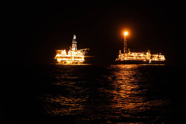 FPSO tanker vessel near Oil platform Rig.