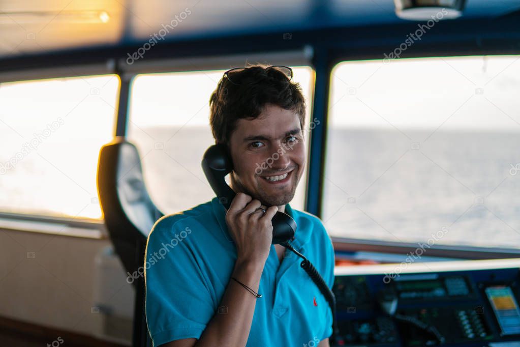 Marine navigational officer is reporting by VHF radio