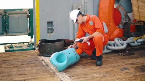 Chief officer on deck of ship or vessel with checklist — Stock Video