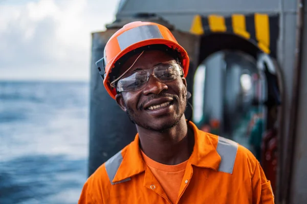 happy Seaman AB or Bosun on deck of vessel or ship