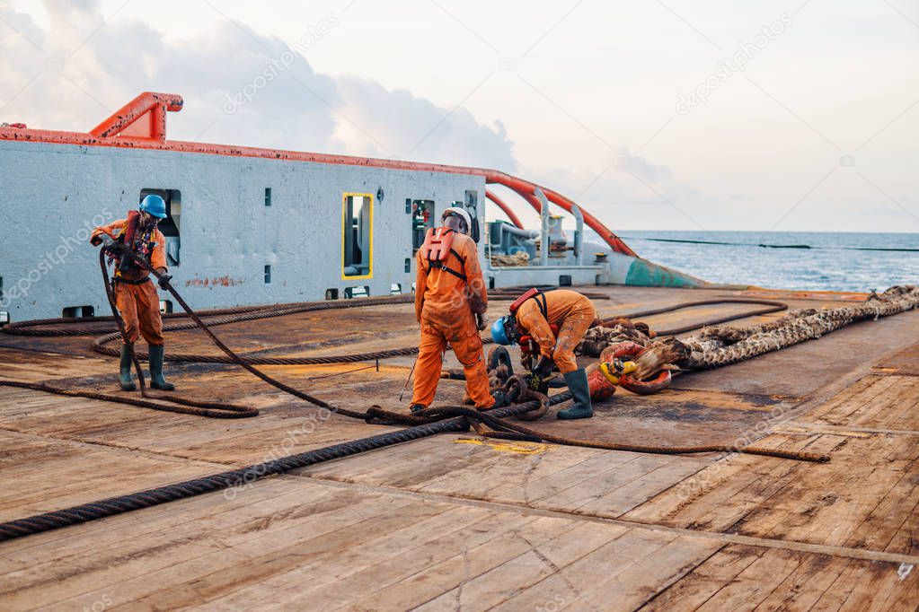 Vessel crew preparing vessel for static tow tanker lifting