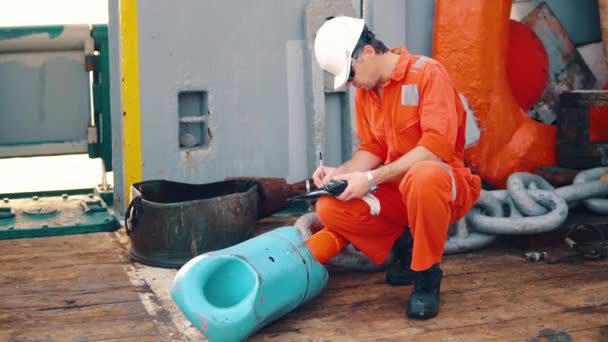 Chief officer on deck of ship or vessel with checklist — Stock Video