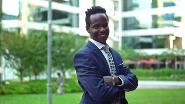 African American businessman wearing blue suit standing — Stock Video