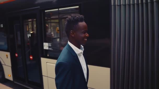 African American businessman wearing blue suit walking — Stock Video