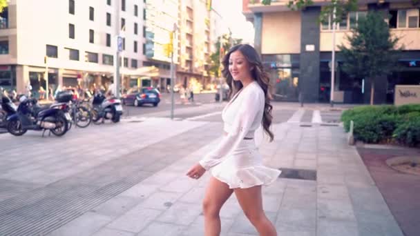 Portrait of young stylish asian girl on the street of big modern city — Stock Video