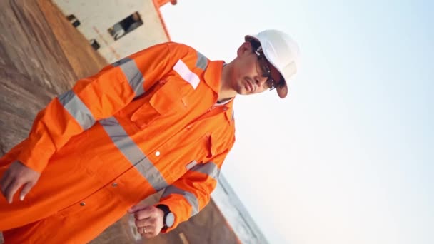 Filipino deck Officer on deck of vessel or ship , wearing PPE personal protective equipment — Stock Video