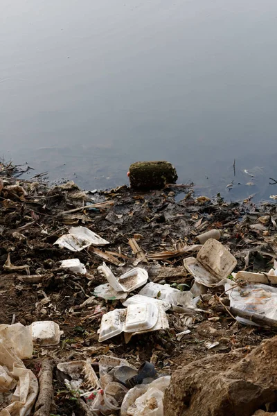 Plastic garbage in the river , pollution and environment in the