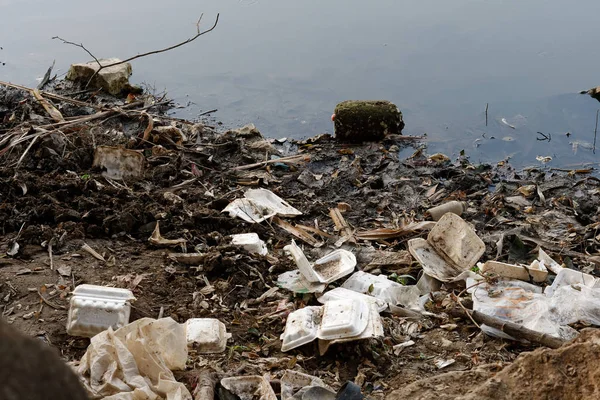 Plastic garbage in the river , pollution and environment in the