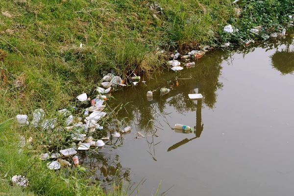 Plastic garbage in the river , pollution and environment in the Stock Photo