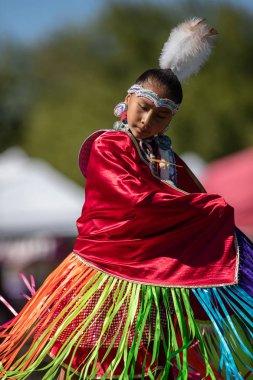 Participants dancing Native American style at the Stillwater Pow Wow in Anderson, California. clipart