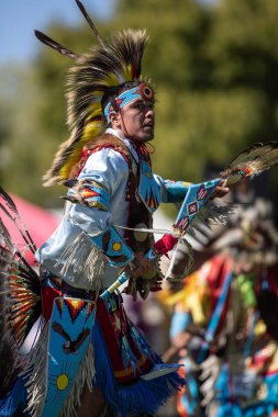 Participant dancing Native American style at the Stillwater Pow Wow in Anderson, California. October, 7, 2018. clipart