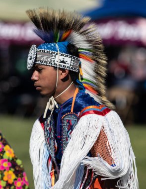 Participant dancing Native American style at the Stillwater Pow Wow in Anderson, California. October, 7, 2018. clipart
