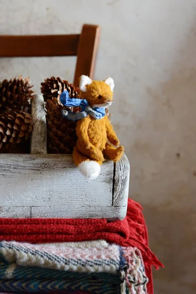 closeup,toy,fox,animal,doll,red,cute,gift,small,plaid,home,cozy,woolen,blanket,pillow,throw,interior,chair,linen,gray,fabric,stack,pillows,wool,background,modern,design,beige,knitted,bedroom,vintage,winter,room,comfortable,lifestyle,decor,house,casua