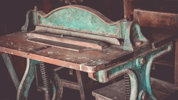 Close up of set old antique letterpress printing black ink machine. Vintage letterpress manual machine.