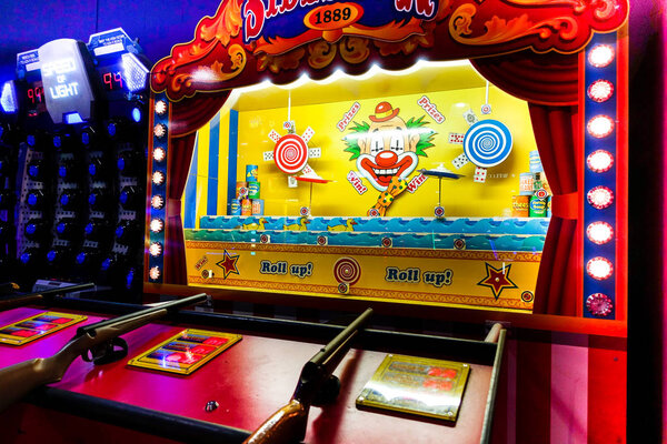 Brighton, England-2 October,2018: Classic vintage sideshow shooting gallery theme park arcade game carnival in casino game at the Hollywood Bowl Brighton Marina the place for entertainment and fun.