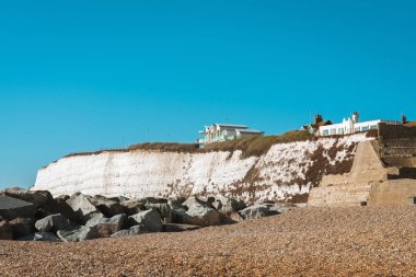 Saltdean beach seafront cliffs with weekend house in the background at East Sussex Brighton marina, UK. clipart