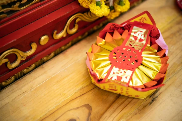 Golden chinese folded paper ghost and gods for burning, Ghost and gods money offering in the temple in Chinese temple.