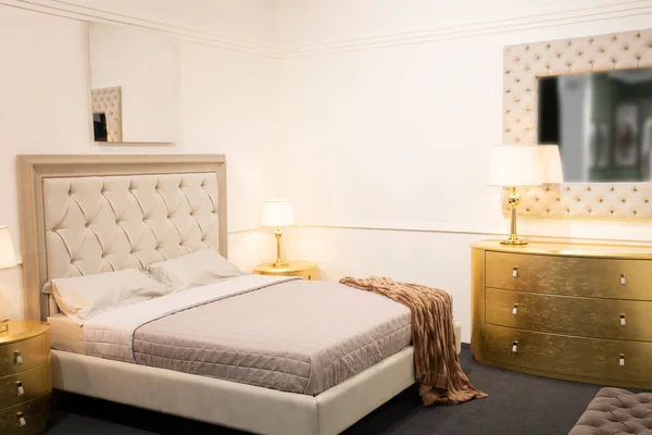 Luxury bedroom interior with royal bed with golden elements
