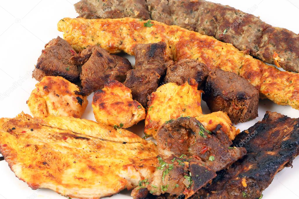 Mixed charcoal grilled platter chicken beef mutton goat meat shish kebab tawook middle east Arab 