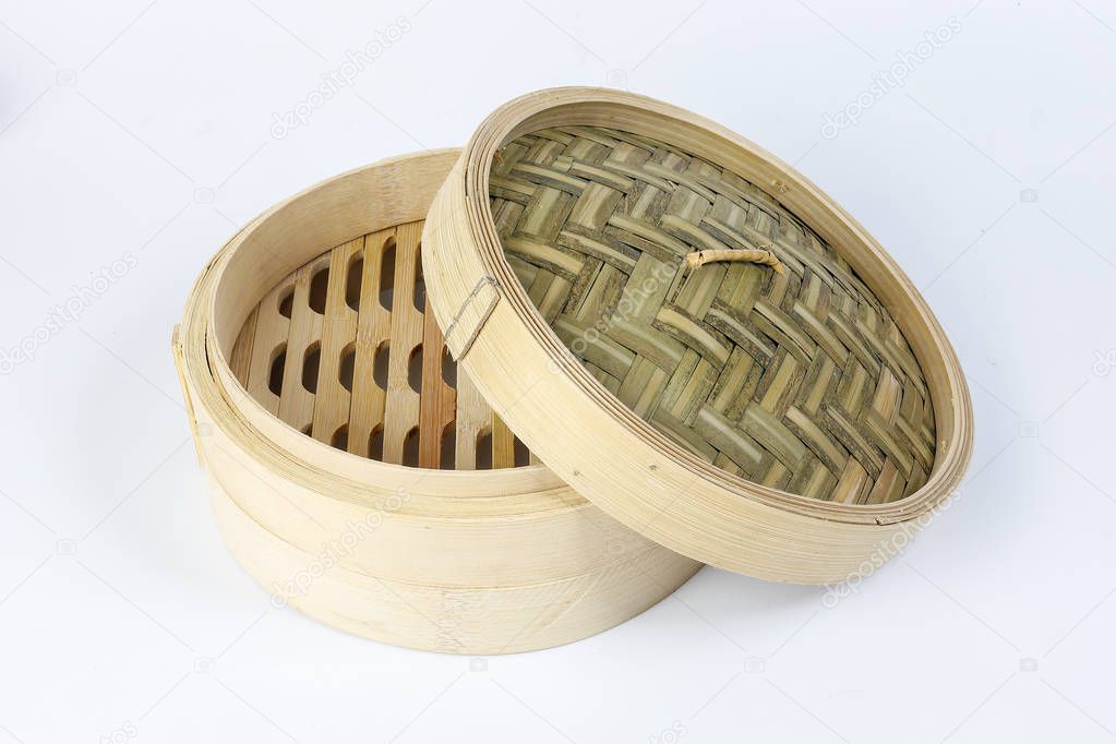 Wooden bamboo dim sum steamer on white background 