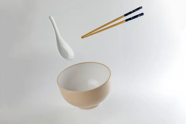 Empty Oriental Japanese Chinese Soup Bowl Spoon Chopstick Elevated Flying — Stock Photo, Image
