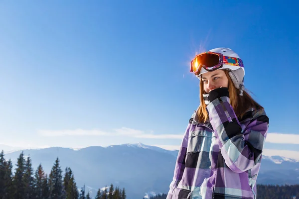 Blonde in helmet among mountains — Stock Photo, Image