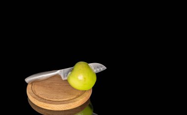 Juicy green apples isolated on black background, close-up.