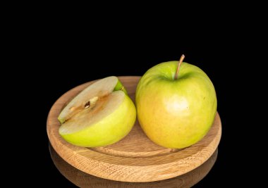 Juicy green apples isolated on black background, close-up.