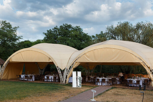 Outdoor wedding reception in tent