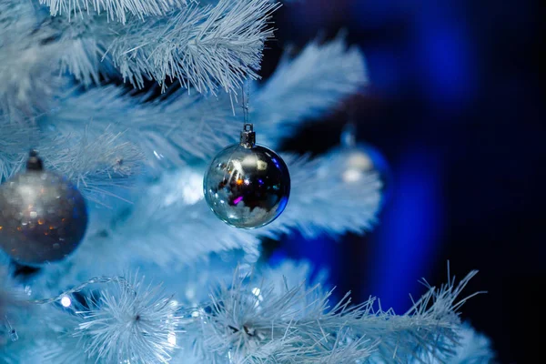 Christmas balls on a white fluffy Christmas tree — Stock Photo, Image