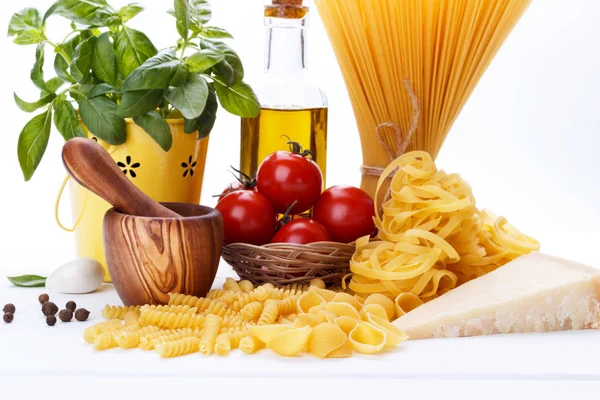 Raw Pasta Ingredients White Background Tomatoes Basil Olive Oil Spaghetti — Stock Photo, Image