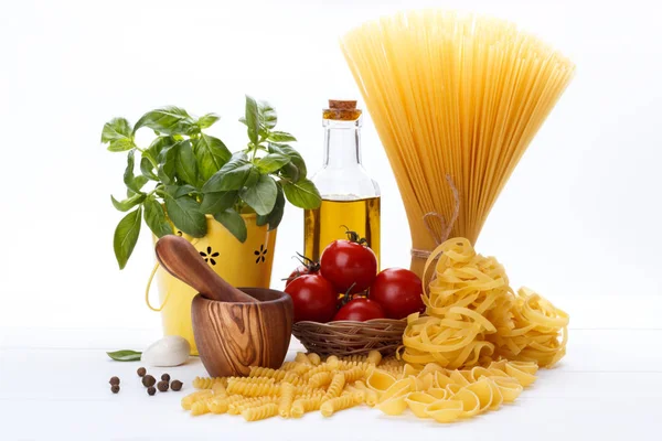 Raw Pasta Ingredients White Background Tomatoes Basil Olive Oil Spaghetti — Stock Photo, Image