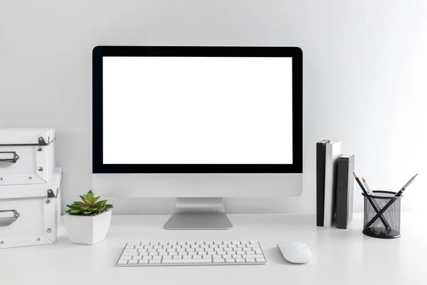 White modern desktop with computer and stationary items. Minimalistic workplace of student or freelancer, mock up