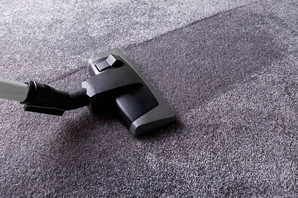 Grey carpet and cleaner — Stock Photo, Image