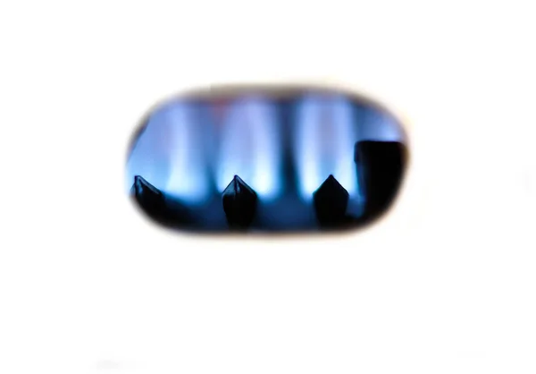 Home gas fired boiler, water heater. Gas fire close up. Selective focus.