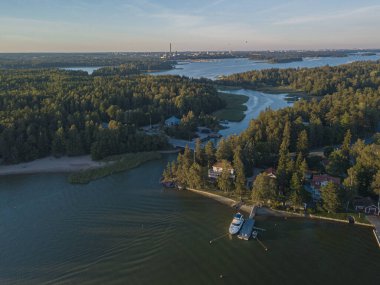 Photo from a drone over the sea, sunny evening, Scandinavian nature, yacht, Gulf of Finland, Finland. clipart