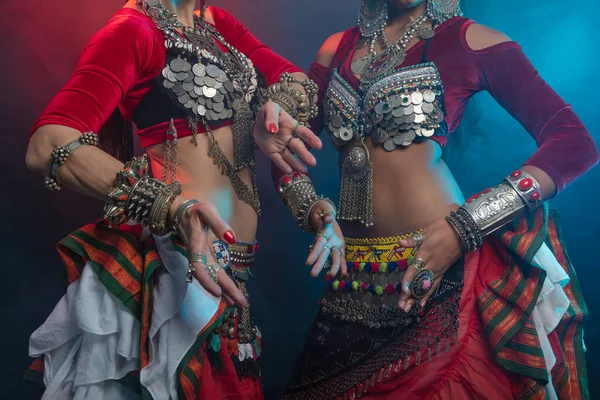 Belly dancers, indian dancers and flamenco dancers close-up cropped photo Bundled suits, ancient is layered Indian skirts, Afghans, ancient Yemeni jewelry, many colors, iron and wealth.