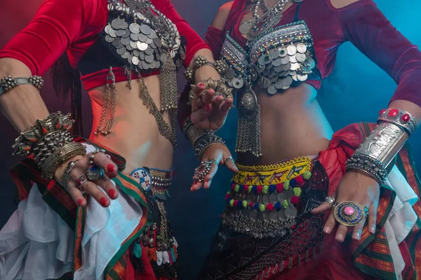 Belly dancers, indian dancers and flamenco dancers close-up cropped photo Bundled suits, ancient is layered Indian skirts, Afghans, ancient Yemeni jewelry, many colors, iron and wealth.
