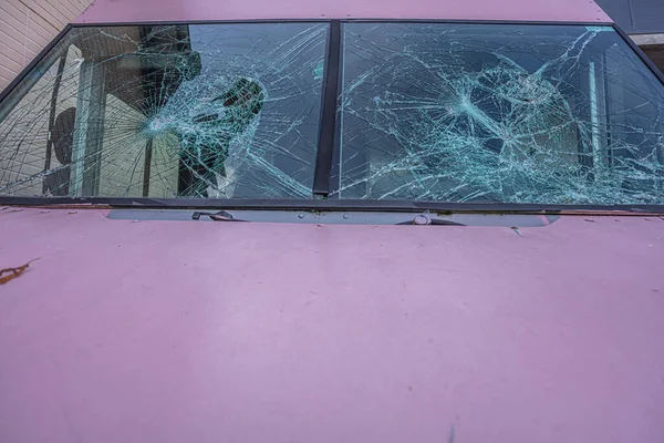 Broken windshield near the car. Machine repair concept.